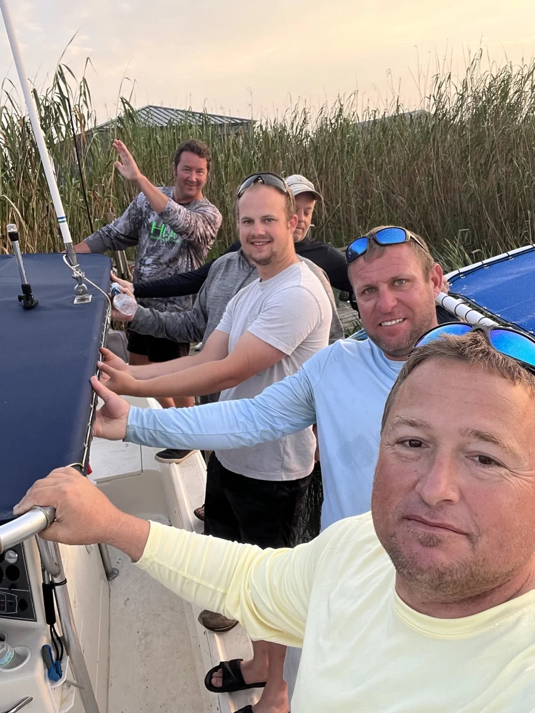 A group of friends together aboard a boat