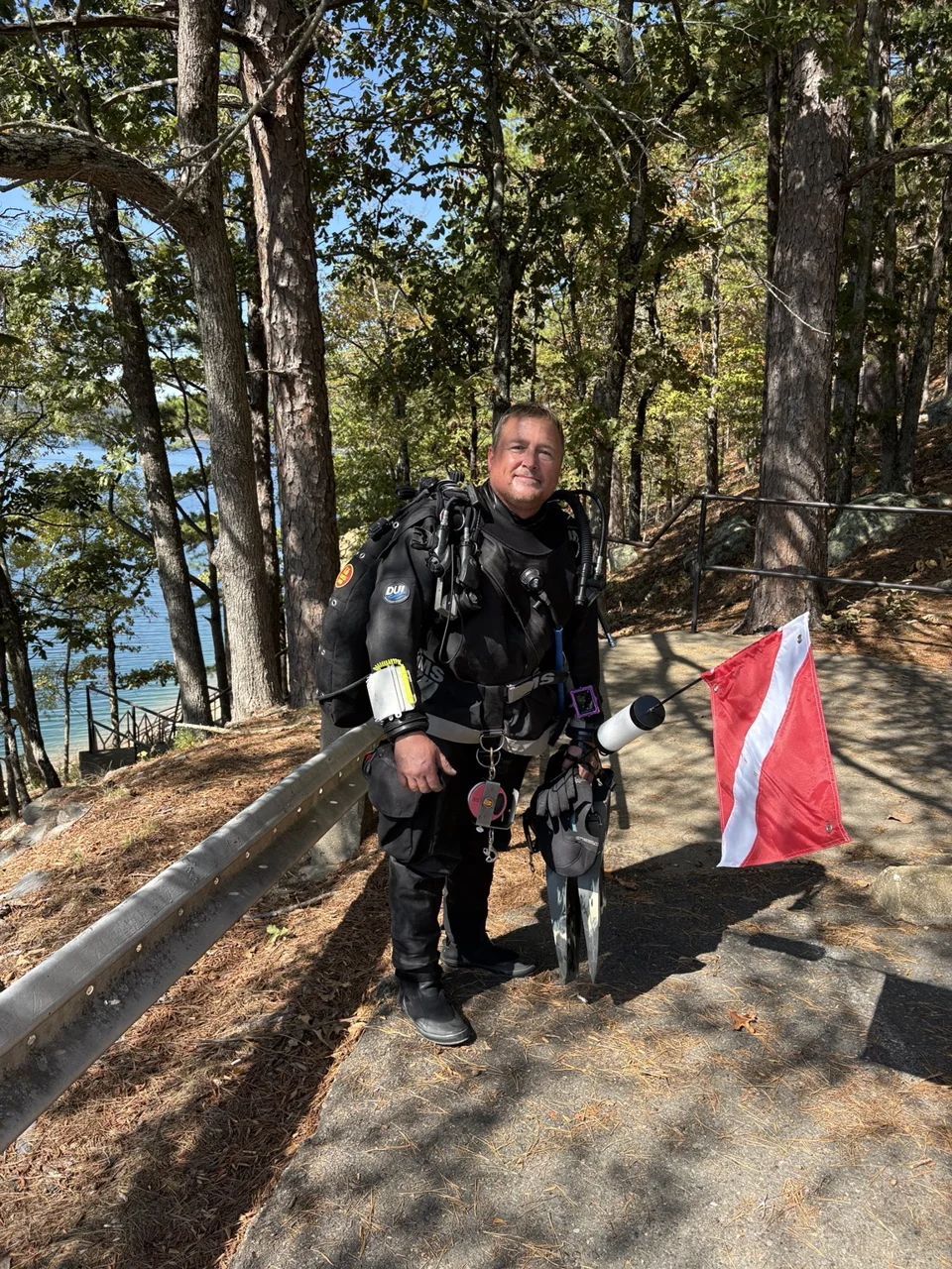 Mike in scuba equipment beside an Arkansas lake